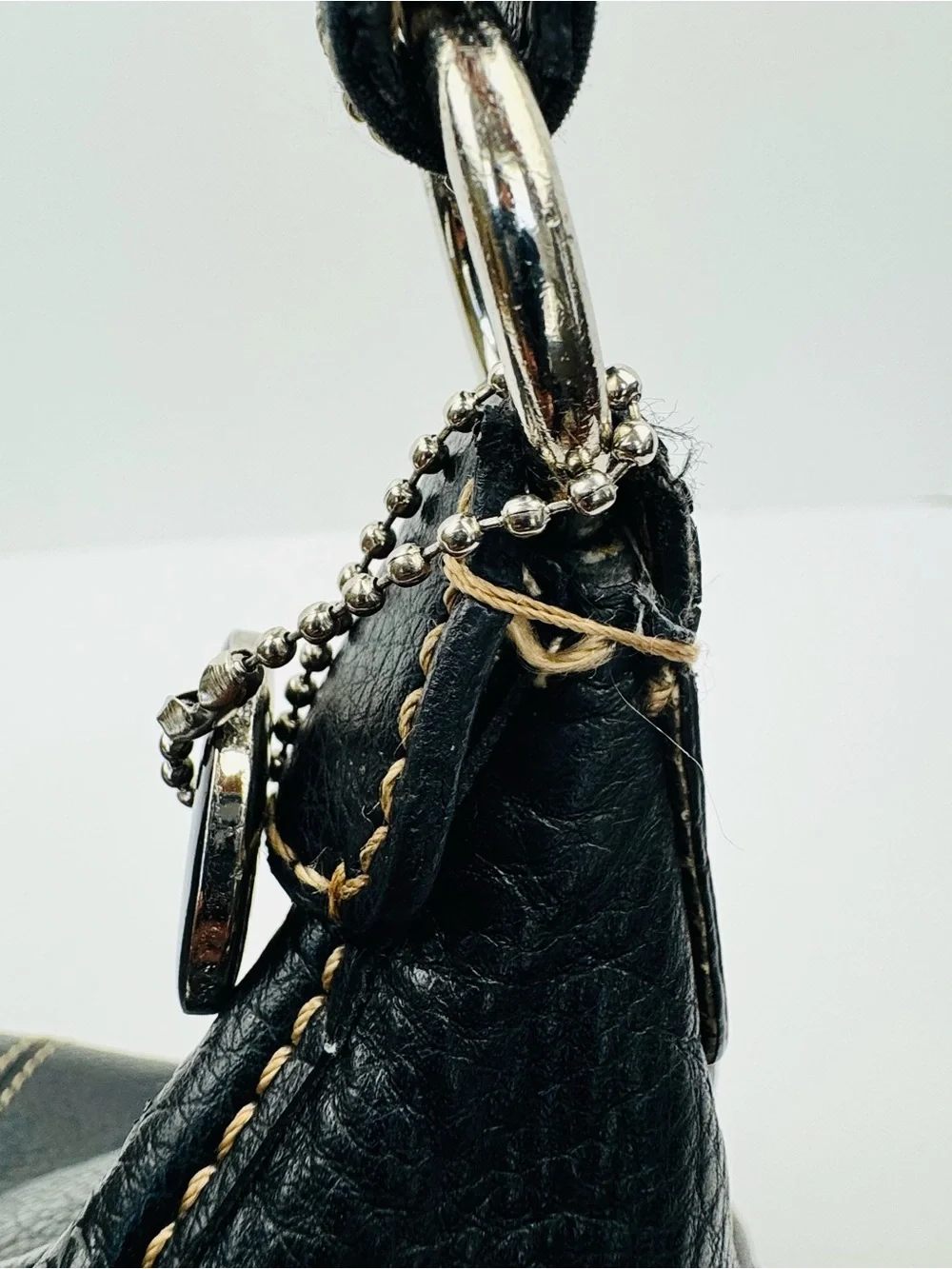 The Sak Baggett hobo. Pebbled leather. Silver-tone hardware. Slouchy Y2K style